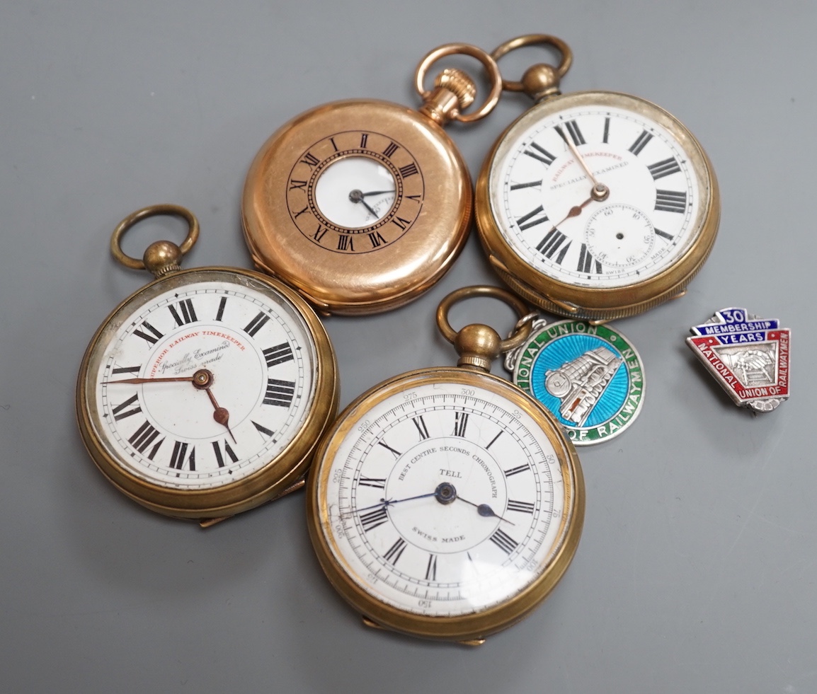 Two base metal Railway Timekeeper pocket watches, one other base metal pocket watch, a gold plated pocket watch and a railway badge and medallion.